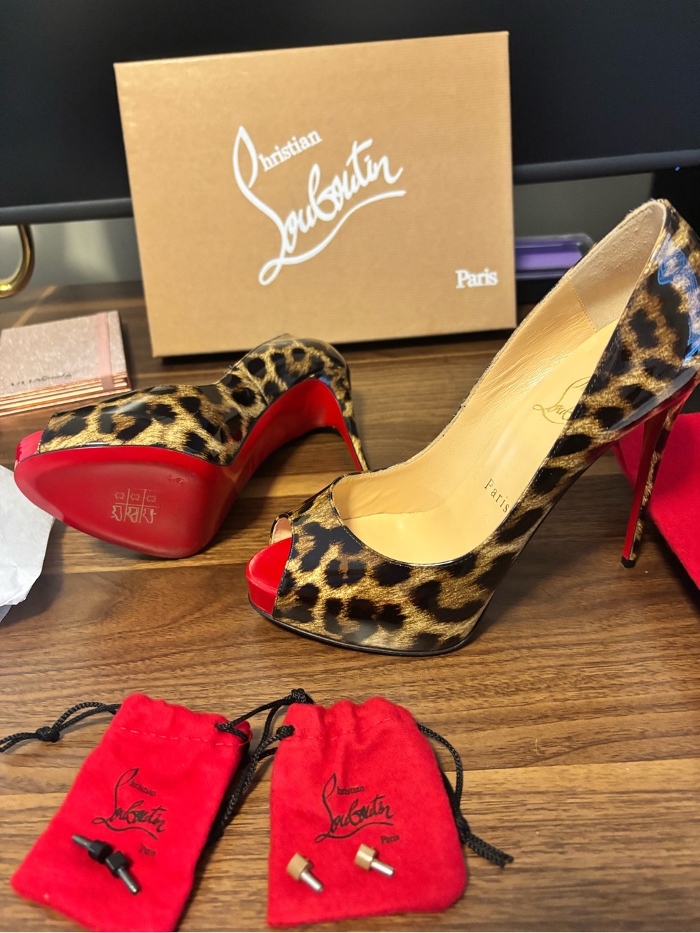 Christian Louboutin Leopard Print Peep-Toe Pumps with Red Soles